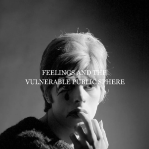 Young David Bowie in 1967 posing in a white cashmere sweater, photographed by Gerald Fearnley